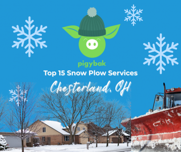 Snow plow clearing a driveway in Chesterland Ohio after a winter storm