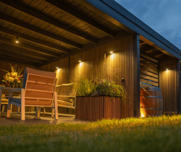 Outdoor patio lighting with string lights and pathway illumination at dusk