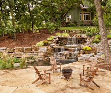 Low maintenance landscaping with mulch beds and native plants around suburban home